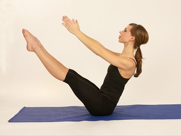 Certified Pilates Mat Teacher Woman doing Pilates mat exercise teaser